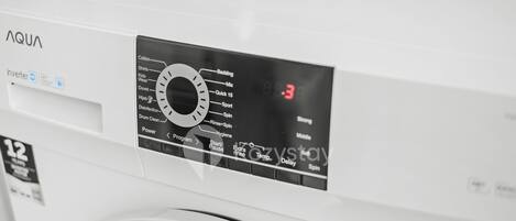 A front view of a white washing machine with a control panel displaying various settings and a digital display showing the time as 19:3.