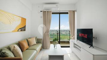 Apartamento, 2 quartos, vista para a cidade | Área de estar