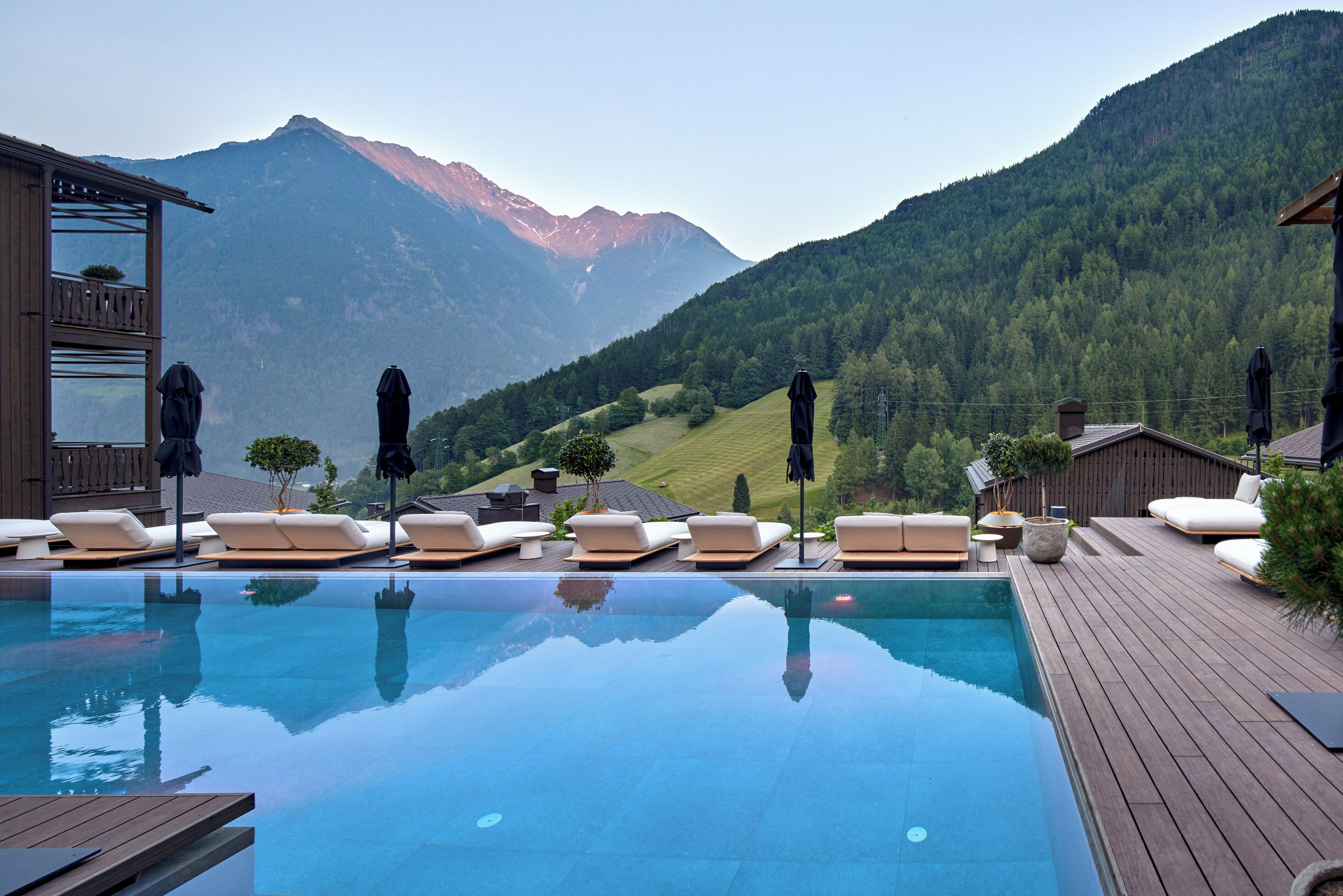 Indoor pool, outdoor pool, pool umbrellas, sun loungers
