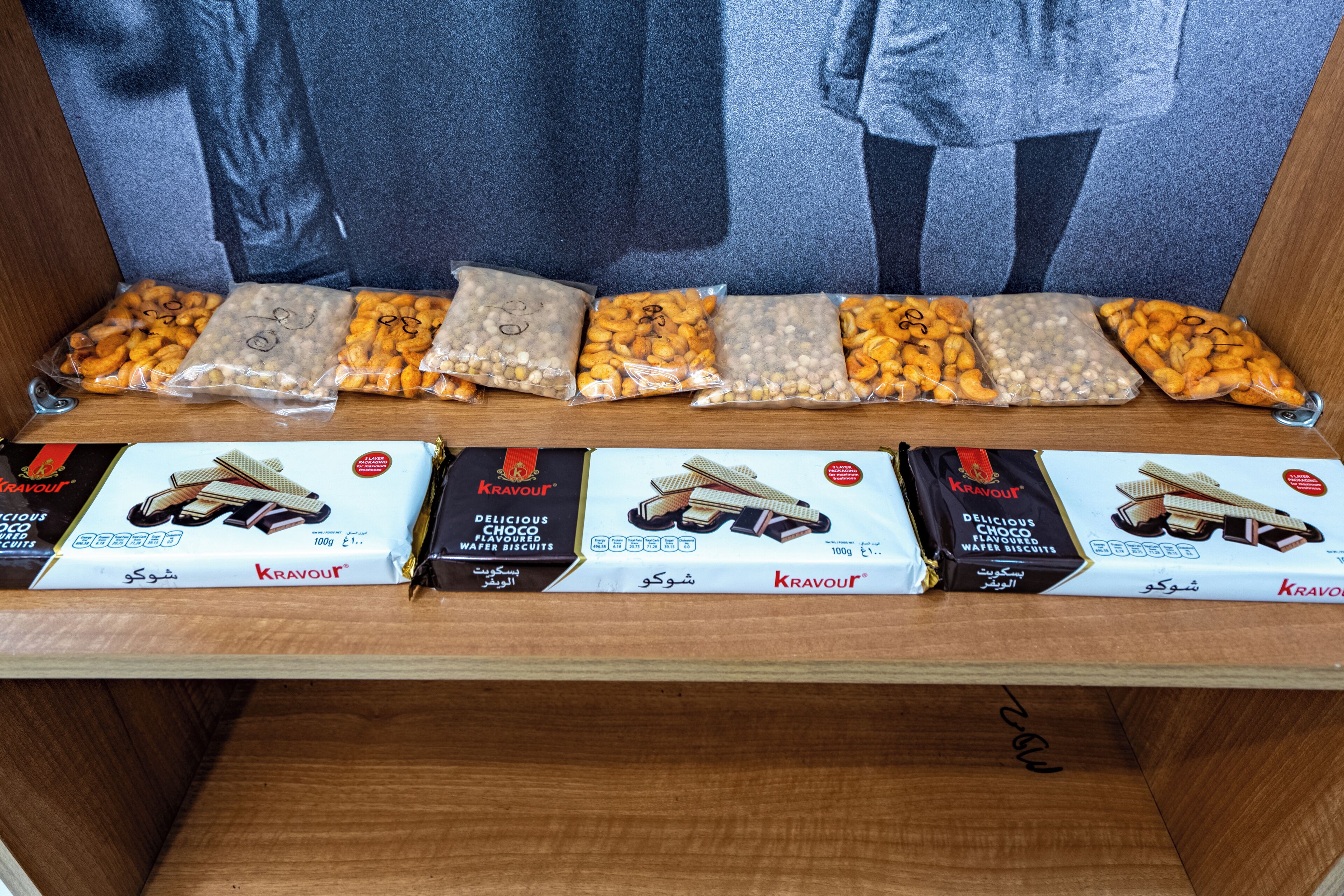 A shelf with Kravout chocolate wafer biscuits and their packaging.