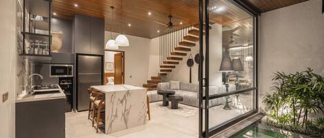 Deluxe Villa, 2 Bedrooms, Balcony, Pool View | Living area | 40-inch Smart TV with digital channels