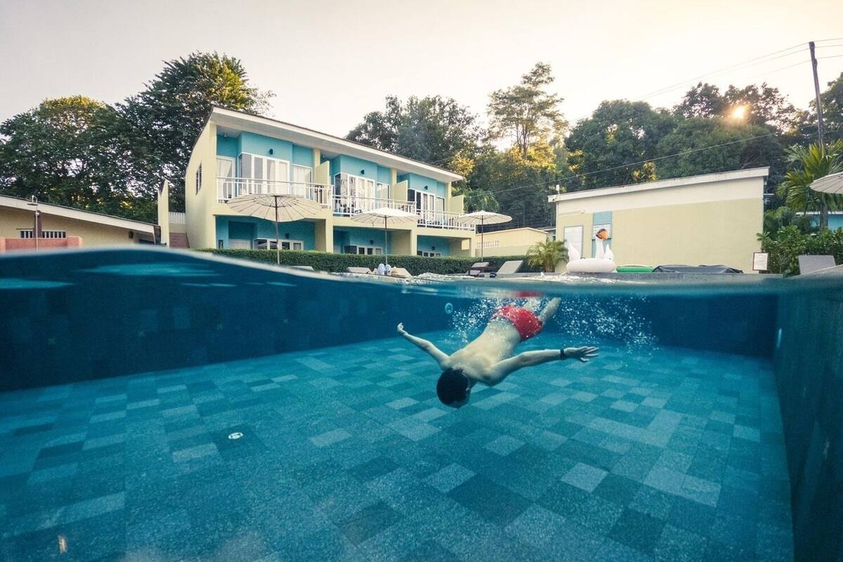 A swimming pool with a person swimming.