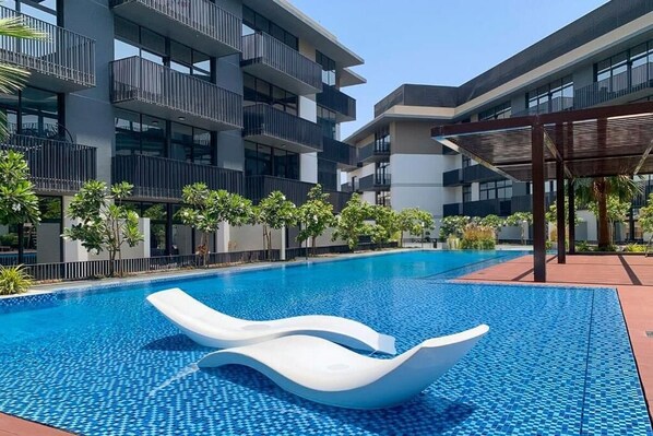 Outdoor pool - Manzil-1BR Apt with Pool in JVC (Dubai)