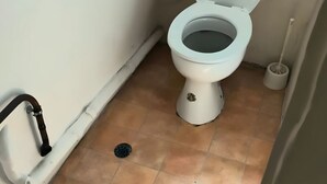 A small bathroom with a toilet, a hand dryer, and a floor drain. - Studio FullEquiped 2person with balcony 17th (Paris)