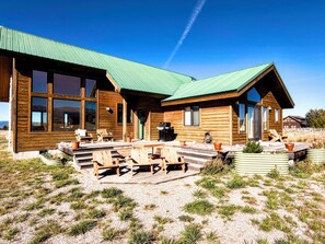 The back porch is the perfect place to relax, enjoy a cup of coffee or a night cap, and snap photos of the Tetons.