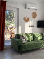 Deluxe Apartment, Balcony, Sea View | Living area