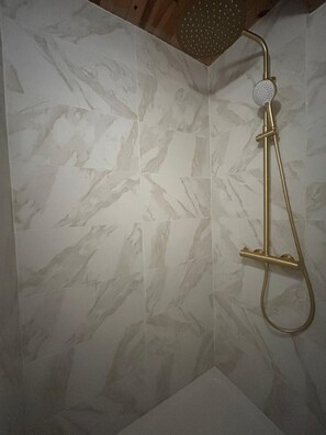 Shower, hair dryer, towels, toilet paper