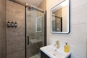 Shower, hair dryer, towels, soap