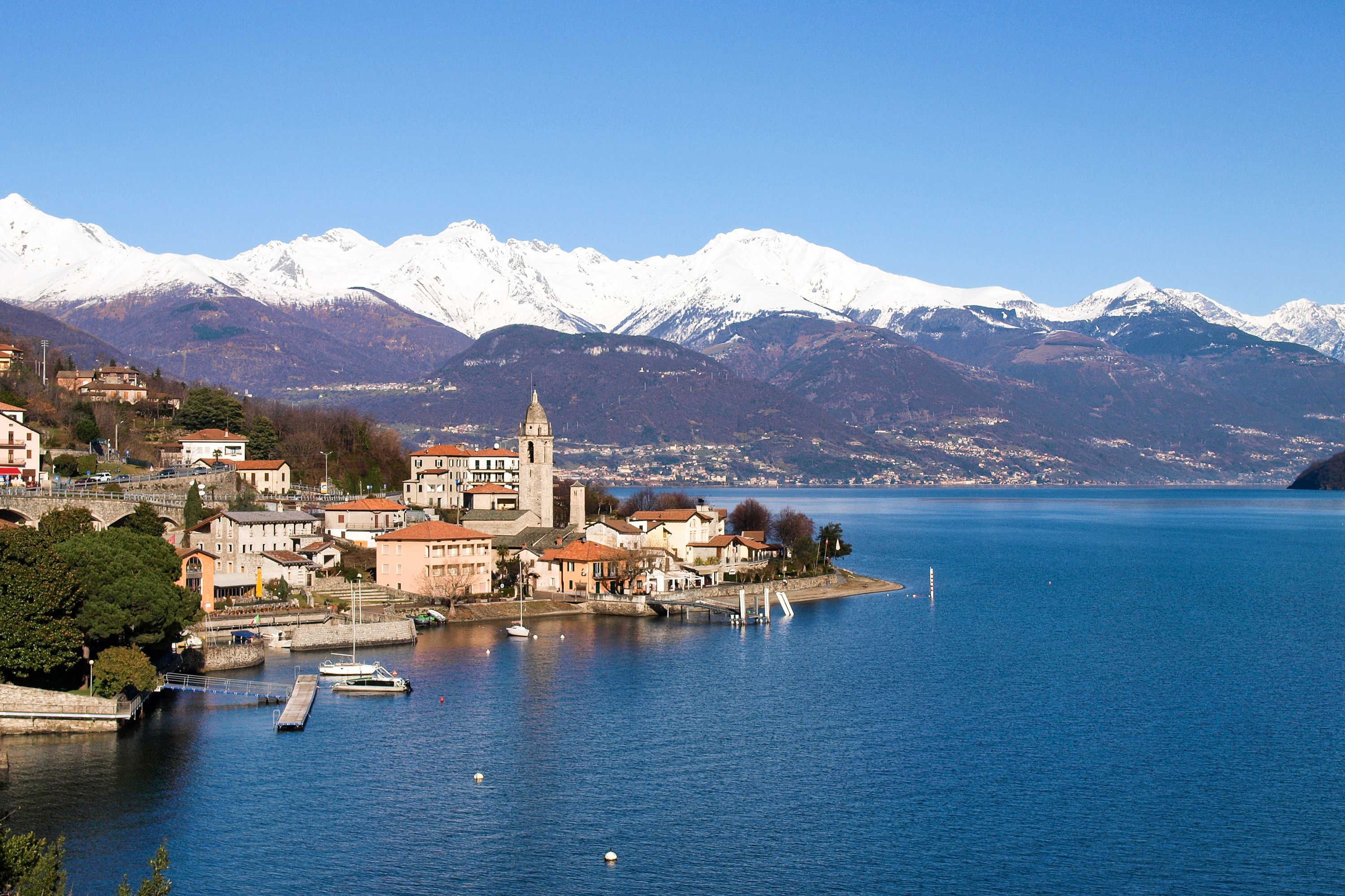 A coastal town with a church, residential buildings, and a marina.