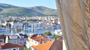 A coastal town with buildings and boats by the water. - Stunning View Suite With Balcony (Trogir)