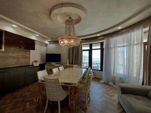 Deluxe Apartment, Balcony, Lake View | Living area | Flat-screen TV, heated floors, printers