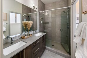 Shower, hair dryer, towels, shampoo