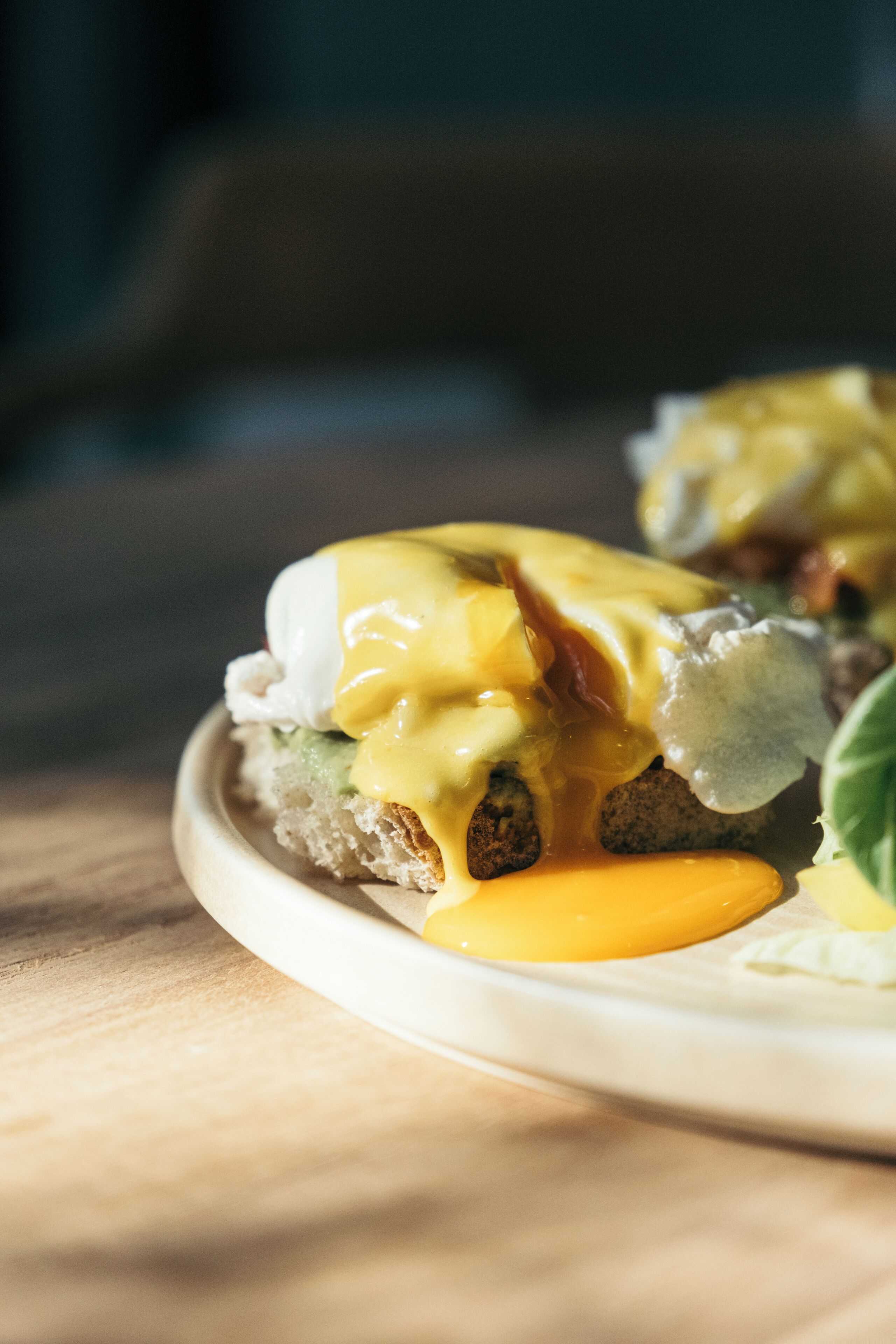 A breakfast dish with eggs, cheese, and bacon.