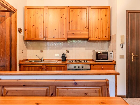 Microwave, oven, dining tables