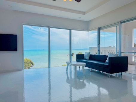 Superior Villa, Ocean View | Living area | 60-inch flat-screen TV with digital channels