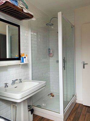 Shower, hair dryer, towels, soap