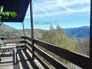 Enjoy breathtaking views of the surrounding mountains from this deck.