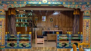 A traditional bar with wooden walls and colorful decorations. - Hotel Jakar View (Bumthang)