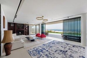 Panoramic Villa, 4 Bedrooms, Private Pool, Sea View | Living area | 65-inch Smart TV with digital channels - Al Zorah Villa - Mint Stay (Ajman)