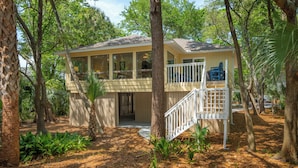 A two-story house surrounded by trees. - Wild Dunes-Twin Oaks-Updated, sleeps 8, walk to beach and nearby shops! (Isle of Palms)