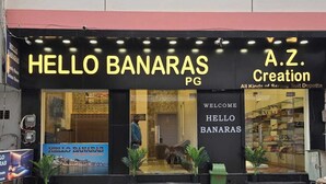 A building with two storefronts, one named 'HELLO BANARAS PG' and the other 'A.Z. Creation'. - Hello Banaras (Varanasi)
