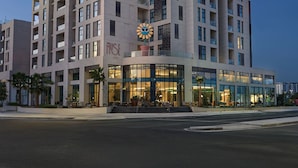 A multi-story hotel with a modern design, featuring balconies and large windows. - The Muse Hotel  (Lusail)
