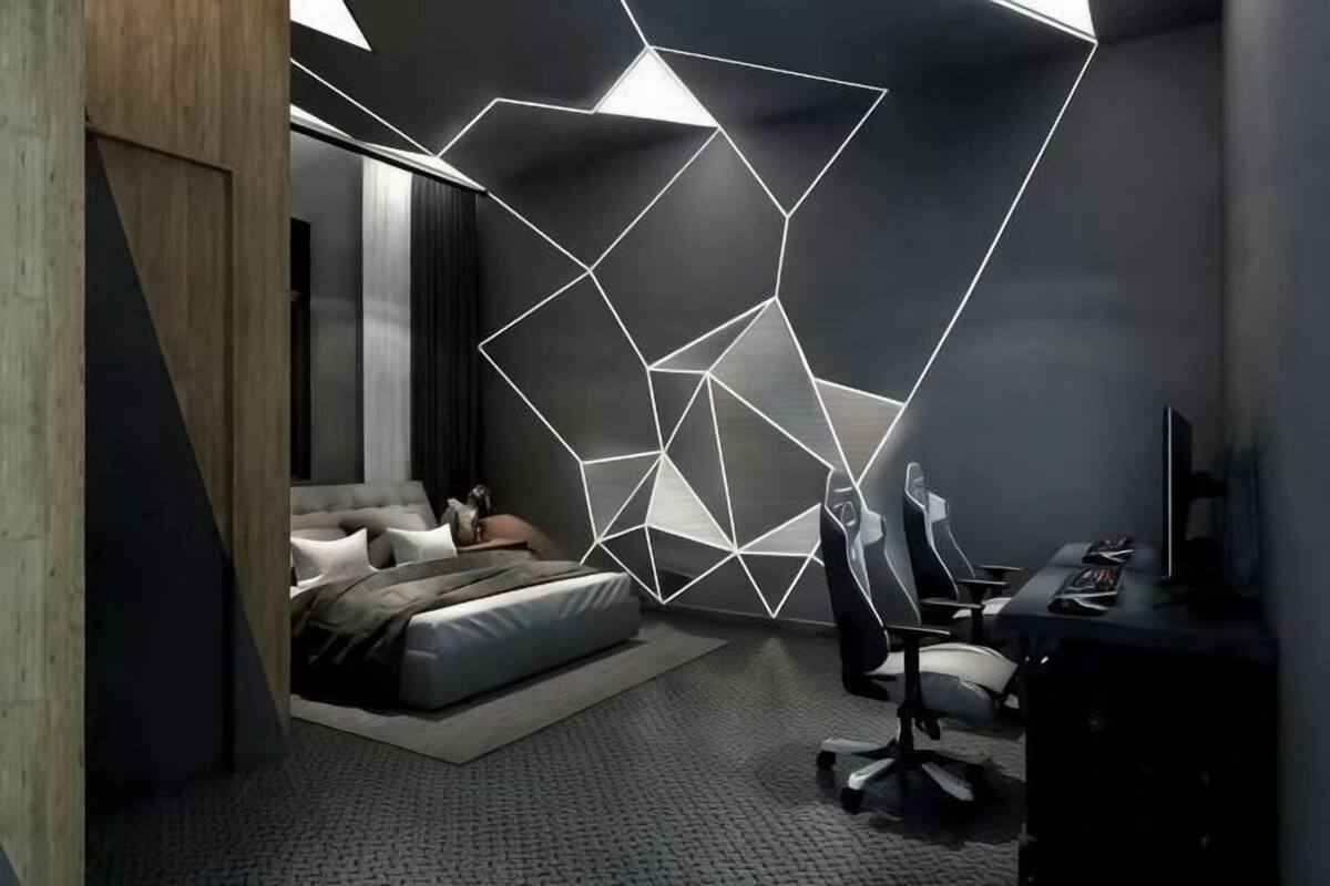 Una camera da letto moderna con un'illuminazione geometrica, un letto, una scrivania e una sedia.