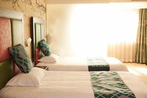 A hotel room with two beds, a large window, and a curtain. - Vienna 3 Best Hotel (Beijing)