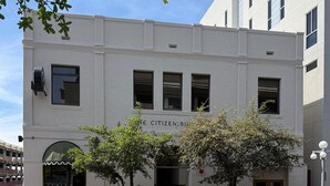 A building with a white facade, multiple windows, and a sign that reads "The Citizen Building." - Downtown Boutique Hotel with Popular Cocktail Bar (Tucson)