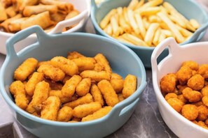 Bowls of food items, including tater tots and French fries. - Super 8 Hotel (Beijing Peking University Hospital Gaomidian North Subway Station) (Beijing)