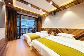 A hotel room with two beds, wooden ceiling beams, a large window with curtains, and a view of buildings outside. - Fuyuan Riverview Homestay (Fenghuang County)