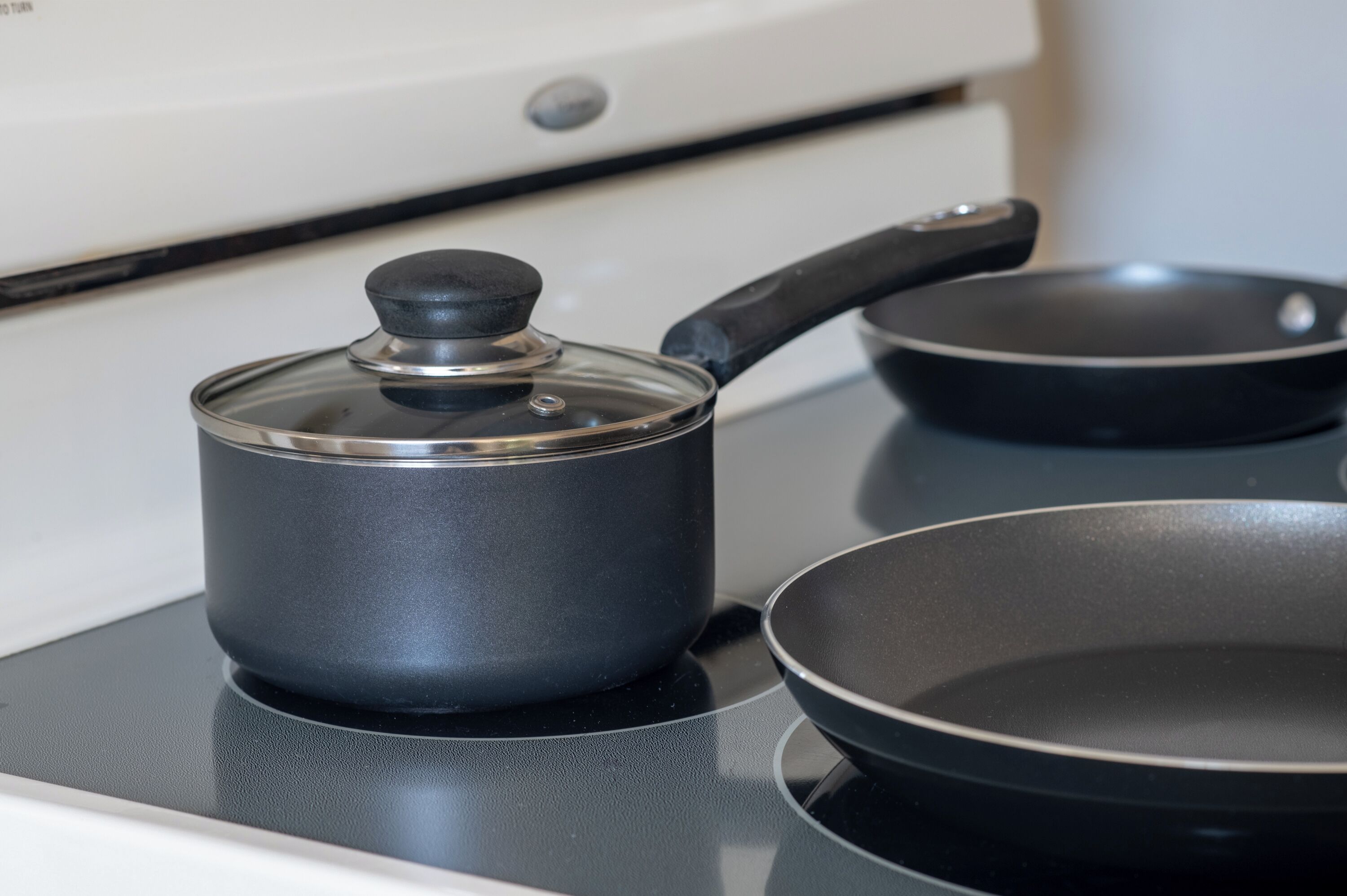 A stove with a pot and a pan on it.