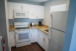Deluxe Studio Suite, 2 Queen Beds | Private kitchen | Full-size fridge, microwave, oven, stovetop