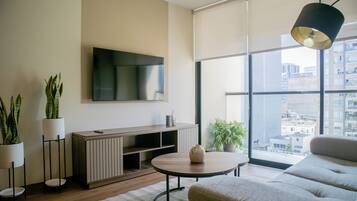 Apartment (606) | Living room | 55-inch flat-screen TV with digital channels