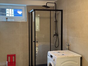 Shower, hair dryer, towels, soap