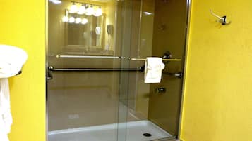 Deluxe Studio Suite, Garden View | Bathroom | Combined shower/bathtub, hair dryer, towels, soap