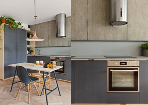 Enjoy cooking in this kitchen with a central island, oven, and stainless steel range hood.