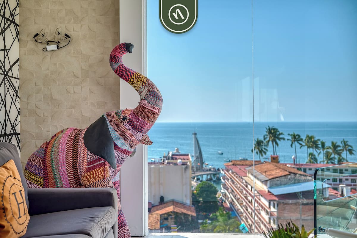 Departamento Elite, balcón, vista al mar | Área de sala de estar