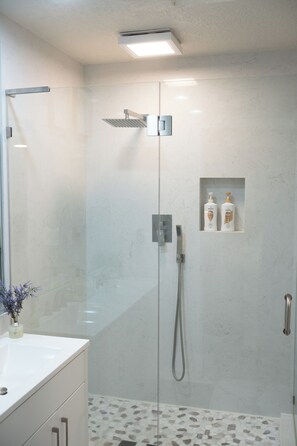 Shower, hair dryer, towels, soap