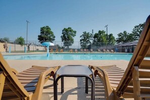 A swimming pool area with lounge chairs and a water slide. - Gorgeous and ALL NEW, Resort, Pools, Lake, Branson (Branson)