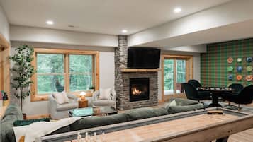 Smart TV, fireplace, foosball, books