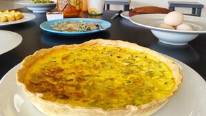 A dining table with a quiche, a pitcher, and a bowl of eggs. - Boutique eco Agriturismo nestled among ancient olive trees and stunning Tuscan hills (Santa Luce)