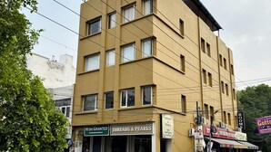 A multi-story building with a sign reading "HOLIDAY VILLA". - HolidayVilla & Suites Amritsar (Amritsar)