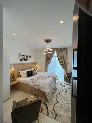 Luxury Studio Suite, City View | Desk, laptop workspace, free WiFi
