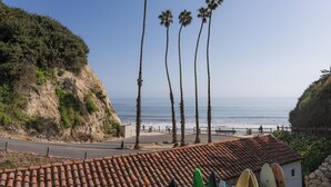 A coastal road with palm trees, a beach, and a tiled roof structure. - Stunning Hope Ranch view home, outstanding amenities, private beach. 30 day min. (Santa Barbara)