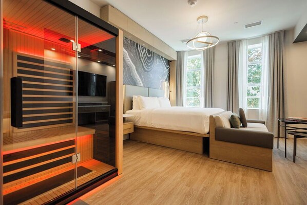 Suite (Wellness King) | In-room safe, laptop workspace, blackout drapes, iron/ironing board - POSH on Kirkwood A Boutique Hotel (Bloomington)