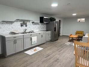 Fridge, microwave, stovetop, coffee/tea maker