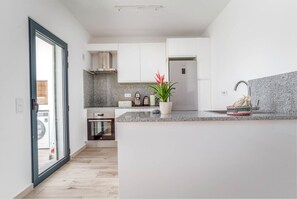 Fridge, stovetop, dishwasher, dining tables
