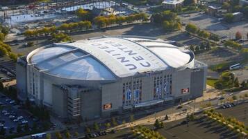 A large, modern building with a distinctive dome roof and the words "CENTER" on it.