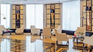 A spacious lobby with a polished floor, several seating areas, and large windows. - CQ Second Normal University Academic Exchange Center Hotel (Chongqing)